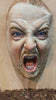 Zoom into a cculpture of a man with his mouth open